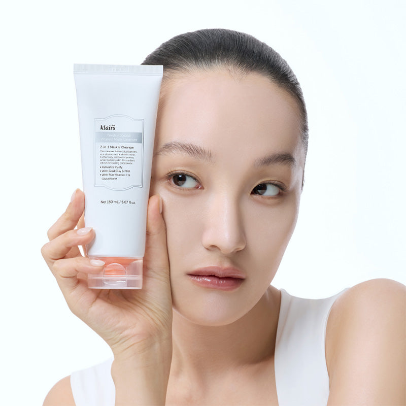 Person holding a klairs cleanser with a white background, Korean face cleanser for gentle daily cleansing, LUME